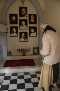 March, 2012, Notre Dame d'Atlas priory in Medelt, Morocco: Fr. Jean Pierre Schmacher, last survivor of the Tibhirine monastery, pictured in front of the portraits of the 7 murdered monks, and in the lower right, another surviving monk who has since died.